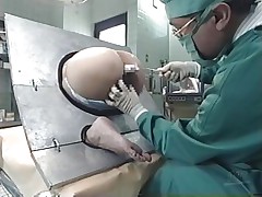 Take a look at what's going on here. A marvelous Nippon sweetheart is the subject of an experiment and she can't do no thing except obey and allow the scientist to do his job. This chab inserts different liquids in her ass, filling her up. Why is she here and what's happening? Let's find out!